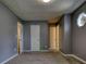 Bedroom features a gray accent wall, neutral carpet and an octagonal window for plenty of natural light at 924 Park Gate Pl, Stone Mountain, GA 30083