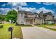 Front exterior showcasing the well-maintained lawn, charming facade, and driveway at 924 Park Gate Pl, Stone Mountain, GA 30083