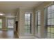 Bright living room with lots of natural light from the multiple windows and view of the front yard at 924 Park Gate Pl, Stone Mountain, GA 30083