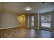 Comfortable living room with new flooring, neutrally painted walls, and a stairway at 924 Park Gate Pl, Stone Mountain, GA 30083
