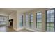 Well-lit living room with large windows, a stone fireplace, and attractive new floors at 924 Park Gate Pl, Stone Mountain, GA 30083