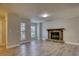 Inviting living room featuring new flooring, neutral paint, and a cozy stone fireplace at 924 Park Gate Pl, Stone Mountain, GA 30083