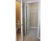 Bright bathroom with tile flooring, toilet, and an adjacent walk-in closet at 1245 Mclendon Dr, Decatur, GA 30033
