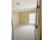 Cozy bedroom featuring neutral carpet, a single window with blinds, and white trim at 1245 Mclendon Dr, Decatur, GA 30033