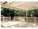 Spacious wooden deck with railing overlooking a beautifully wooded backyard at 1245 Mclendon Dr, Decatur, GA 30033
