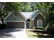 Charming home with stone accents, two-car garage, and well-maintained landscaping at 1245 Mclendon Dr, Decatur, GA 30033