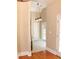 Hallway featuring hardwood floors and access to the patio and other rooms at 1245 Mclendon Dr, Decatur, GA 30033