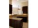 Kitchen with granite countertops, dark wood cabinetry, and modern appliances at 1245 Mclendon Dr, Decatur, GA 30033