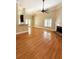 Bright living room featuring hardwood floors, fireplace, ceiling fan, and large windows at 1245 Mclendon Dr, Decatur, GA 30033