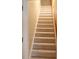 Carpeted stairway leading to upper level with wooden handrail at 1245 Mclendon Dr, Decatur, GA 30033