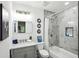 Bathroom with marble shower, modern vanity, and updated fixtures at 2160 Perkerson Sw Rd, Atlanta, GA 30315
