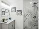 Beautiful bathroom featuring a marble tiled shower and modern vanity at 2160 Perkerson Sw Rd, Atlanta, GA 30315