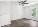 An empty bedroom featuring modern flooring, a door, and a window at 2160 Perkerson Sw Rd, Atlanta, GA 30315