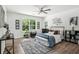 Bright bedroom features hardwood floors, a ceiling fan, and contemporary decor at 2160 Perkerson Sw Rd, Atlanta, GA 30315