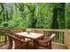 Outdoor deck with dining table and comfortable wicker chairs at 2160 Perkerson Sw Rd, Atlanta, GA 30315