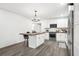 Modern kitchen features white cabinets, stainless appliances, and an island at 2160 Perkerson Sw Rd, Atlanta, GA 30315