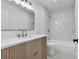 Modern bathroom features a vanity with white counters and a shower-tub combo at 2601 Garland Way, Duluth, GA 30096