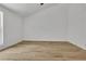 Empty bedroom features wood-look floors, white walls and a vaulted ceiling at 2601 Garland Way, Duluth, GA 30096