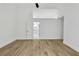 Bright open-concept bedroom with wood-look floors and attached bathroom at 2601 Garland Way, Duluth, GA 30096