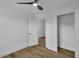 Bright bedroom features wood-look flooring, a modern ceiling fan and an adjoining closet at 2601 Garland Way, Duluth, GA 30096
