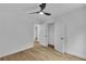 Bright bedroom features wood-look flooring, a modern ceiling fan and adjoining closet at 2601 Garland Way, Duluth, GA 30096