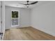 Bedroom with wood-look flooring and a window with natural outdoor views at 2601 Garland Way, Duluth, GA 30096