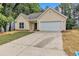 Charming single Gathering home with a well manicured lawn and a two car garage at 2601 Garland Way, Duluth, GA 30096