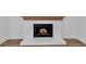 Close up view of brick fireplace with gas insert and wood mantel at 2601 Garland Way, Duluth, GA 30096