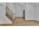 Beautiful foyer featuring a light hardwood floor and staircase with black iron railings at 2601 Garland Way, Duluth, GA 30096