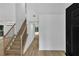 Beautiful foyer featuring a light hardwood floor and staircase with black iron railings at 2601 Garland Way, Duluth, GA 30096