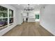 Open kitchen featuring white cabinets, a center island, and modern stainless steel appliances at 2601 Garland Way, Duluth, GA 30096