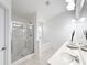 Bathroom featuring a glass shower and a bathtub with a double sink vanity at 2642 Colleen Ln, Dacula, GA 30019