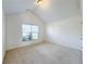 Bright bedroom with neutral carpet and vaulted ceiling at 2642 Colleen Ln, Dacula, GA 30019