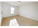This bedroom features natural light and neutral carpeting at 2642 Colleen Ln, Dacula, GA 30019