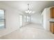 Bright dining area features a modern chandelier and ample natural light at 2642 Colleen Ln, Dacula, GA 30019
