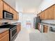 Well-equipped kitchen boasts stainless steel appliances and granite countertops at 2642 Colleen Ln, Dacula, GA 30019