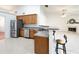 Charming kitchen featuring a breakfast bar, stainless appliances and granite countertops at 2642 Colleen Ln, Dacula, GA 30019