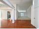 Bright, open-concept living room featuring hardwood floors, white columns and trim, and ample natural light at 2642 Colleen Ln, Dacula, GA 30019