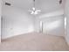 Large main bedroom featuring a ceiling fan, carpet, and two entry doorways at 2642 Colleen Ln, Dacula, GA 30019