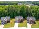 Beautiful aerial view showcasing the home's location within a friendly neighborhood, surrounded by lush greenery and well-maintained lawns at 4348 Tillage Path, Douglasville, GA 30135