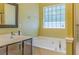 This secondary bathroom features granite counters and a large tub at 4348 Tillage Path, Douglasville, GA 30135