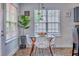 Charming eat-in kitchen area with pendant lighting, a square table, and unique, modern chairs at 4348 Tillage Path, Douglasville, GA 30135