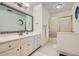 Bright bathroom featuring single sink vanity, shower, and tiled floor at 5161 Hermitage Dr, Powder Springs, GA 30127