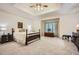 Spacious bedroom features a tray ceiling, plush carpeting, and a large window with window seat at 5161 Hermitage Dr, Powder Springs, GA 30127