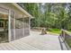 Outdoor deck area with railings and screen porch at 5161 Hermitage Dr, Powder Springs, GA 30127