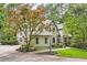 Charming traditional-style home with manicured landscaping and mature trees in a serene, wooded setting at 5161 Hermitage Dr, Powder Springs, GA 30127