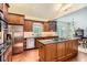 Gourmet kitchen with stainless steel appliances, granite countertops, island, and ample storage at 5161 Hermitage Dr, Powder Springs, GA 30127