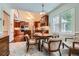 Eat-in kitchen features wood cabinets, stainless steel appliances, and natural light from a large window at 5161 Hermitage Dr, Powder Springs, GA 30127