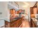 Modern kitchen with central island, stainless steel appliances, and custom wood cabinetry at 5161 Hermitage Dr, Powder Springs, GA 30127