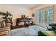 Cozy sitting room with a piano, large windows, and comfortable seating, perfect for relaxation at 5161 Hermitage Dr, Powder Springs, GA 30127
